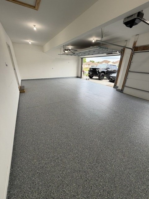 Three-car garage floor epoxy in Kansas City by Surface Shield