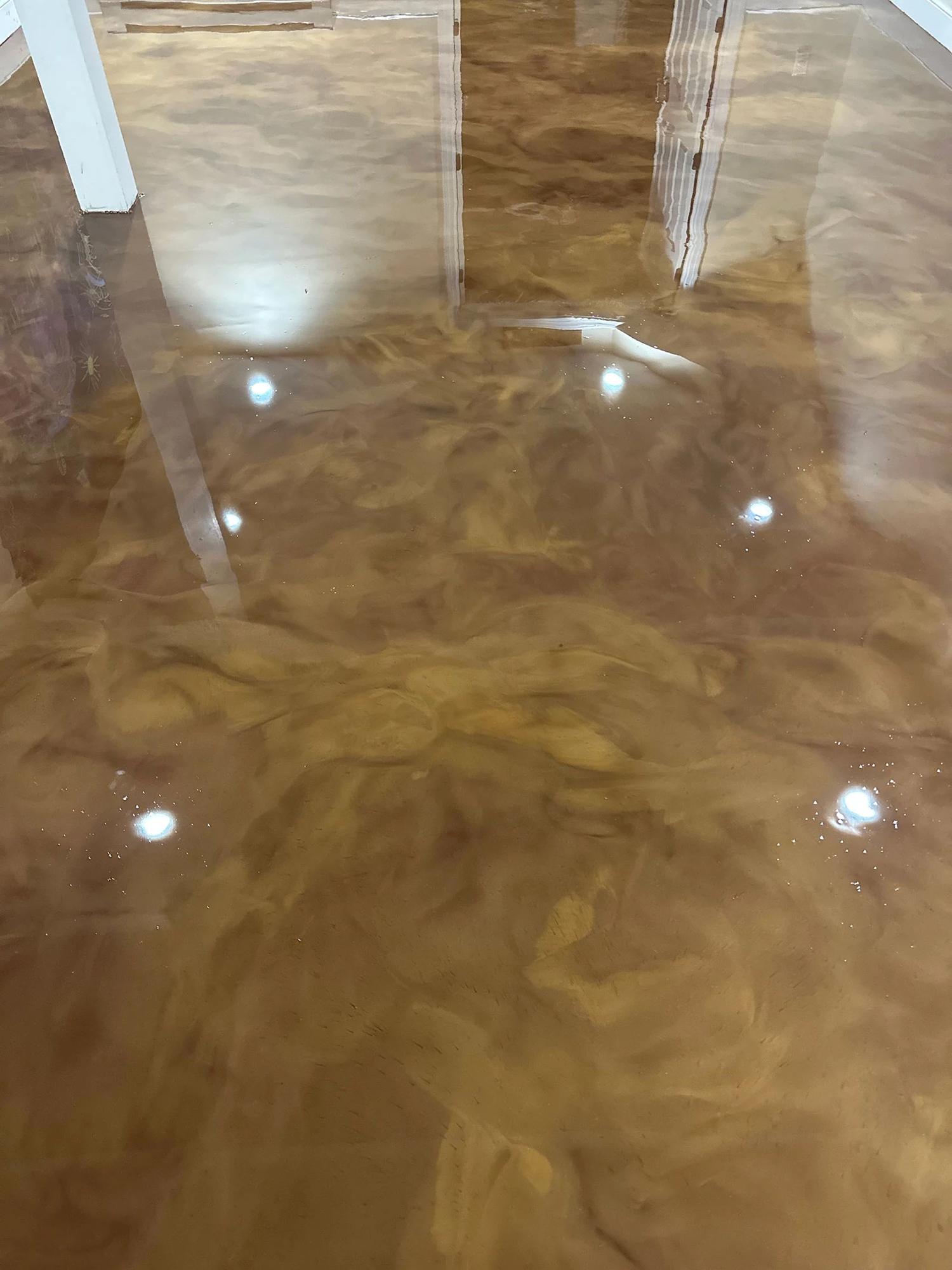 Copper and gold metallic epoxy floor with a mirror finish